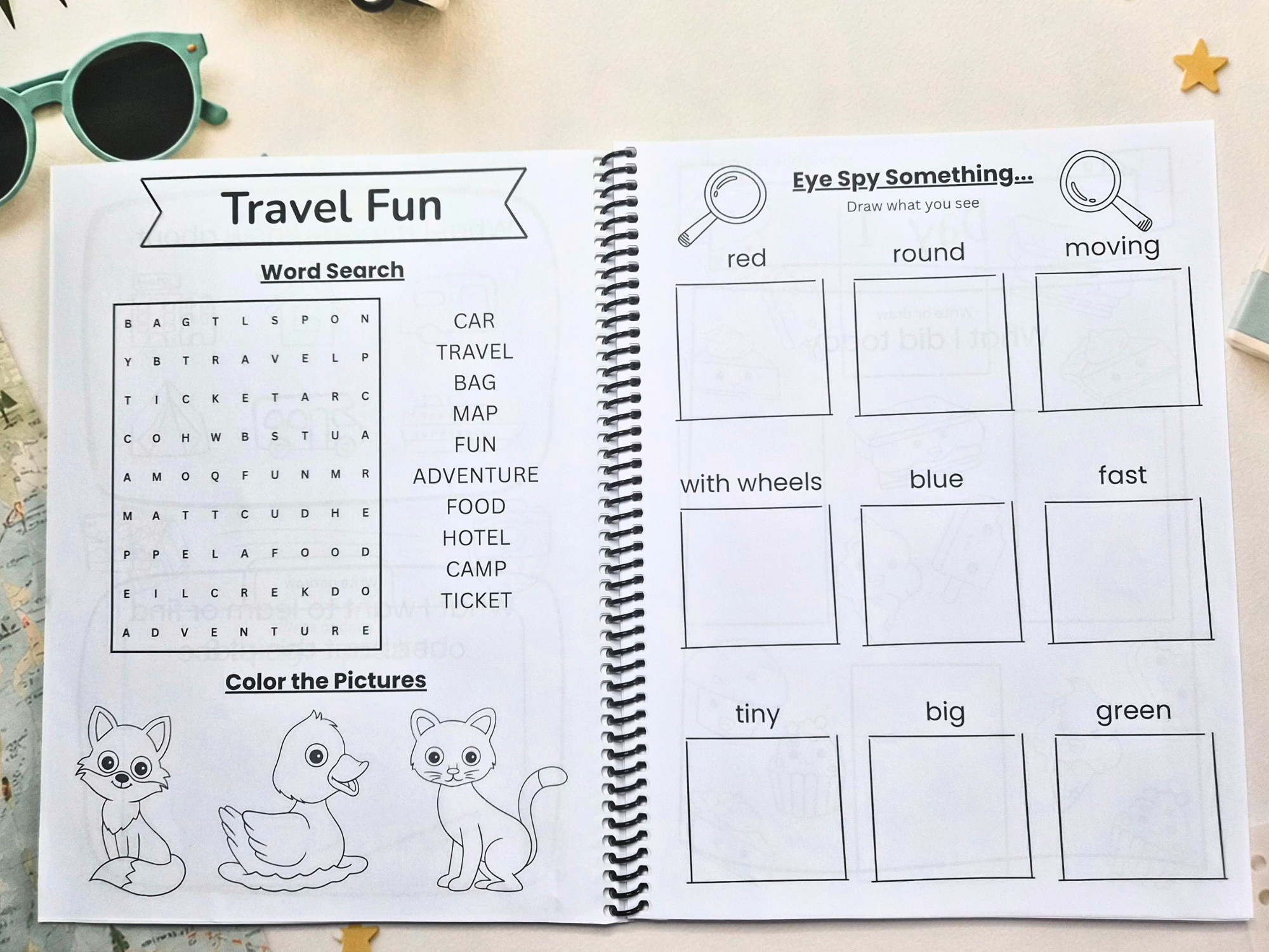 Open pages from the My Travel Journal Junior travel journal featuring a travel word search, colouring activity and eye spy game for kids.