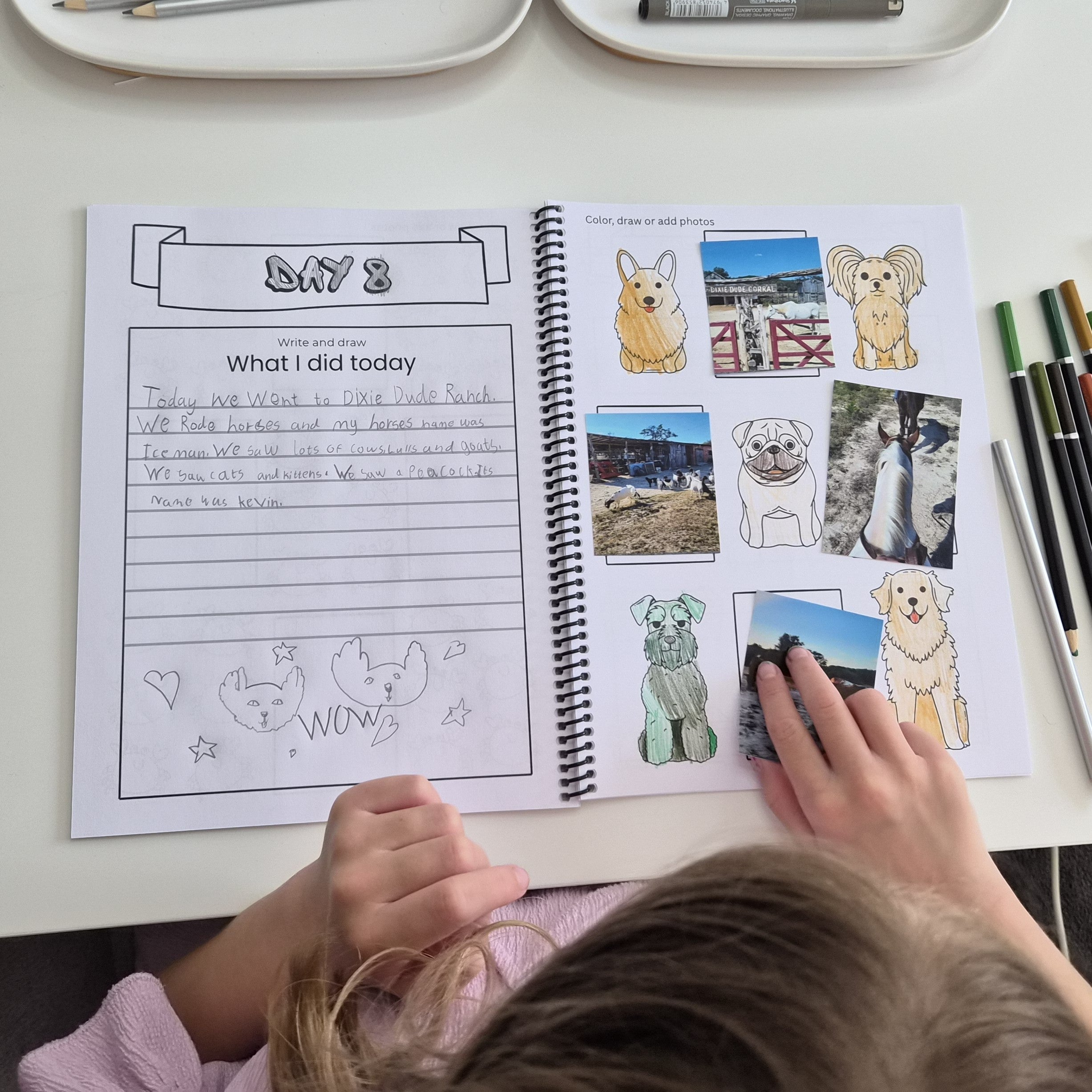 Child using a kids travel journal with guided daily prompts, photo spaces and travel memory pages